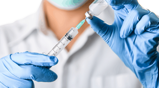 TruMed-REQ-JanBlog-1000×600-Featured Doctor preparing to administer COVID-19 vaccine