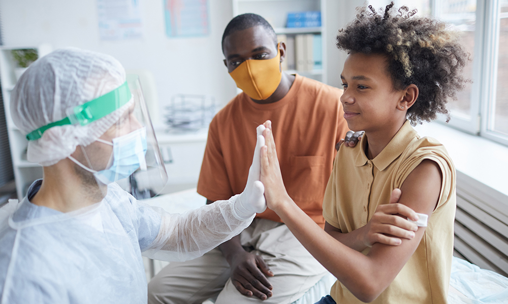 Child receiving pediatric immunizations